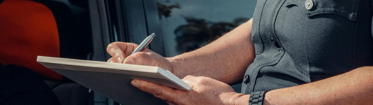 police officer writing a ticket